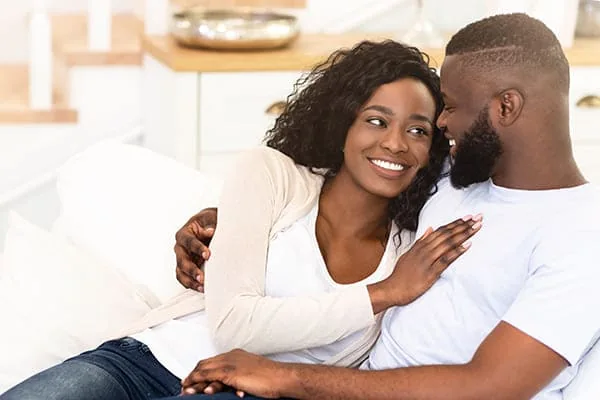 Couple sharing a kiss at home — HIV Dating and PrEP Conversations Between Partners