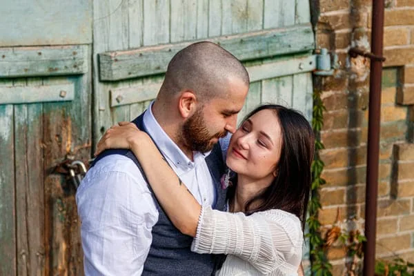 Couple embracing beside a doorway — HIV Dating and Location Privacy Before You Meet