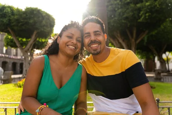 Couple smiling outdoors — HIV Dating Relationship Goals: Choose Your Direction