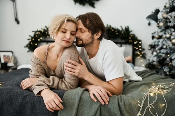 Couple sitting together at home — HIV Dating When Busy: Make Time You Can Keep