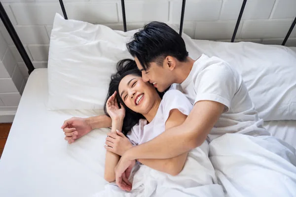 Couple sharing an affectionate moment — Asian HIV Singles Dating With Privacy and Autonomy